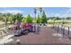 Large community playground features a swing set, picnic shelter and play equipment, with a view of the lake at 12813 Kings Lake Dr, Gibsonton, FL 33534
