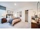 Well-lit bedroom with a comfortable bed, neutral tones, and practical closet space at 13570 Tropical Breeze Way, Hudson, FL 34669