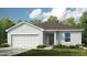 Charming single-Gathering home featuring a two-car garage, low-maintenance landscaping, and a welcoming entrance at 13570 Tropical Breeze Way, Hudson, FL 34669