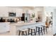 Stylish kitchen boasting stainless steel appliances, a large island with seating, and a modern design at 13570 Tropical Breeze Way, Hudson, FL 34669