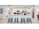 Modern kitchen featuring an island with bar seating, stainless steel appliances, and ample cabinet space at 13570 Tropical Breeze Way, Hudson, FL 34669