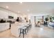 Bright and airy kitchen with island seating, stainless steel appliances, and an open layout at 13570 Tropical Breeze Way, Hudson, FL 34669