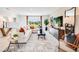 Bright living room features a large sectional sofa and modern décor for comfortable living at 13570 Tropical Breeze Way, Hudson, FL 34669