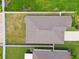 Aerial view of property lines and rooftops with surrounding green spaces at 13603 Wild Ginger St, Riverview, FL 33579