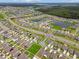 Breathtaking aerial shot of a meticulously designed community featuring serene ponds and beautifully arranged residences at 13603 Wild Ginger St, Riverview, FL 33579