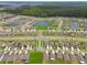 Scenic aerial image of a suburban community, highlighting the harmonious blend of residential areas and recreational ponds at 13603 Wild Ginger St, Riverview, FL 33579