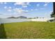 Large, well-maintained backyard features a green lawn and white privacy fence at 13603 Wild Ginger St, Riverview, FL 33579