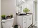 Bathroom with a toilet, sink, cabinets, a granite countertop, and a plant at 13603 Wild Ginger St, Riverview, FL 33579