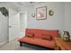 Neutral room showing a futon with colorful pillows and contemporary wall decor at 13603 Wild Ginger St, Riverview, FL 33579