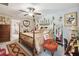 Comfortable bedroom featuring a four-poster bed, decorative accents, and a cozy seating area at 13603 Wild Ginger St, Riverview, FL 33579