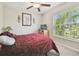 Inviting bedroom with a window offering a view of the neighborhood at 13603 Wild Ginger St, Riverview, FL 33579