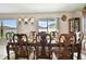 Charming dining room with a wooden table set for a meal, complemented by stylish decor and natural light at 13603 Wild Ginger St, Riverview, FL 33579