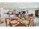 View of the dining room and kitchen, featuring a chandelier, decor and ample natural light at 13603 Wild Ginger St, Riverview, FL 33579