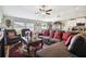 Open-concept living area with a large sectional sofa, connecting the living room to the kitchen and dining areas at 13603 Wild Ginger St, Riverview, FL 33579