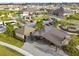 Aerial view of a community picnic area with shelters, seating, and parking surrounded by landscaping at 13603 Wild Ginger St, Riverview, FL 33579