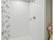 Shower with white tiling and a clear shower curtain at 13603 Wild Ginger St, Riverview, FL 33579