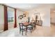 Elegant dining room featuring a table with seating for six and stylish decorations and window at 13621 Tropical Breeze Way, Hudson, FL 34669