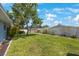 Spacious backyard with well-maintained lawn, offering ample space and privacy at 14204 Yacht Club Blvd, Seminole, FL 33776