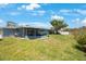 This backyard has a patio and a lawn at 14204 Yacht Club Blvd, Seminole, FL 33776