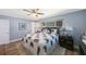Cozy main bedroom featuring a ceiling fan and a large window at 14204 Yacht Club Blvd, Seminole, FL 33776