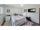 This is a bedroom that includes a TV, dresser, lamp, and bed at 14204 Yacht Club Blvd, Seminole, FL 33776