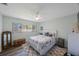 This is a bedroom featuring a rug, window, and bed with pillows at 14204 Yacht Club Blvd, Seminole, FL 33776