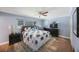 Cozy main bedroom featuring a ceiling fan and a large window at 14204 Yacht Club Blvd, Seminole, FL 33776