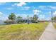 Well-maintained single-story home featuring a lush front yard and mature landscaping at 14204 Yacht Club Blvd, Seminole, FL 33776