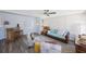Bright sunroom featuring modern furniture, bar, and ceiling fan at 14204 Yacht Club Blvd, Seminole, FL 33776