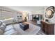 Comfortable living room featuring wood floors, stylish furnishings, and an inviting atmosphere at 14204 Yacht Club Blvd, Seminole, FL 33776