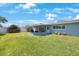 Cozy screened-in patio with seating area, perfect for outdoor entertaining at 14204 Yacht Club Blvd, Seminole, FL 33776