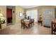 Dining area featuring a table set for four, with lots of room and decor at 1445 Wilson Rd, Clearwater, FL 33755