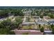 An aerial view of the home displays its backyard, mature trees, and location within a well-established neighborhood at 1607 Melodie Dr, Brandon, FL 33510