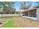 The fenced backyard features a covered patio, providing a private outdoor space at 1607 Melodie Dr, Brandon, FL 33510