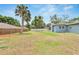 Large backyard featuring a well-maintained lawn and white picket fence at 1607 Melodie Dr, Brandon, FL 33510