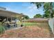 Backyard with a covered patio, garden space and privacy fence at 1607 Melodie Dr, Brandon, FL 33510