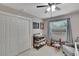 This bedroom offers ample storage with a spacious closet, complemented by a changing station and seating area at 1607 Melodie Dr, Brandon, FL 33510