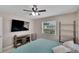 Bedroom with a ceiling fan and view to the outside at 1607 Melodie Dr, Brandon, FL 33510