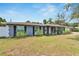 Charming single-story home featuring a well-maintained lawn and inviting front porch at 1607 Melodie Dr, Brandon, FL 33510