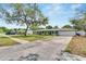 Home features a two-car garage and long driveway at 1607 Melodie Dr, Brandon, FL 33510