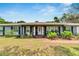 Inviting front porch with decorative columns and landscaping at 1607 Melodie Dr, Brandon, FL 33510