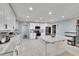 Bright kitchen features white cabinetry, modern appliances, and a center island at 1607 Melodie Dr, Brandon, FL 33510