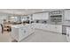 Bright kitchen features white cabinetry, modern appliances, and a center island at 1607 Melodie Dr, Brandon, FL 33510