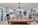 Bright, open kitchen featuring white cabinetry, an island, and modern stainless steel appliances at 1607 Melodie Dr, Brandon, FL 33510