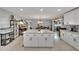 Spacious kitchen features a large island with stone countertops and storage at 1607 Melodie Dr, Brandon, FL 33510