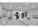 Bright kitchen features white cabinetry, modern appliances, and a center island at 1607 Melodie Dr, Brandon, FL 33510