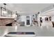 Spacious living room with a bar area, fireplace, and access to a screened patio at 1607 Melodie Dr, Brandon, FL 33510