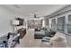 Spacious living room featuring custom built-in bookshelves and ample natural light at 1607 Melodie Dr, Brandon, FL 33510