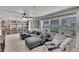 Comfortable living room with a large sectional sofa, built-in shelves and natural light at 1607 Melodie Dr, Brandon, FL 33510