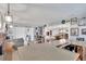 Spacious living room with a bar area, fireplace, and access to a screened patio at 1607 Melodie Dr, Brandon, FL 33510